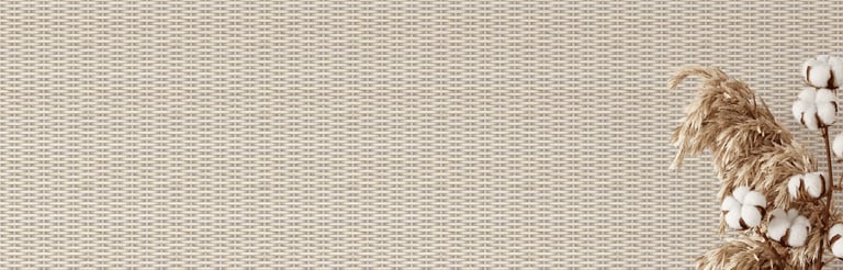 Neutral woven wallpaper background with dried pampas grass and cotton stems in a boho vase.