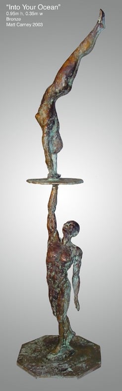 a sculpture of a man with a womandiving into him