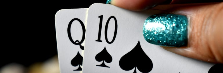 Blackjack hand with green glitter finger nails