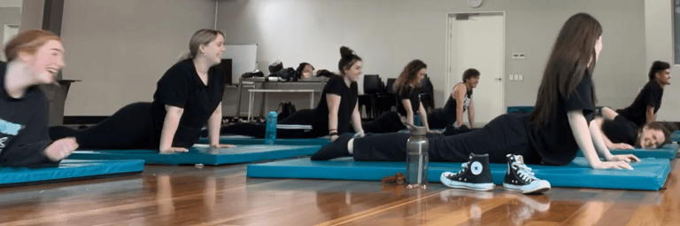 a group of people doing yoga exercises on their own mats