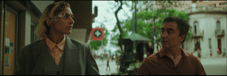 Felix and Alex walking through downtown Córdoba, illustrating a pivotal moment of connection.