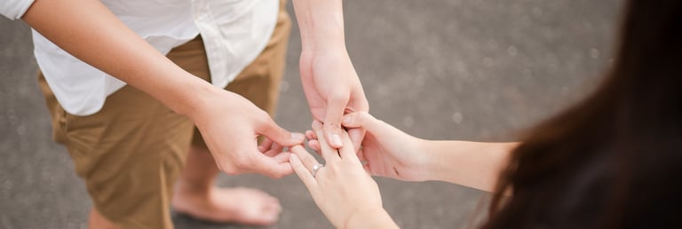Close up of engagement ring during proposal moment at Melasti Beach Bali