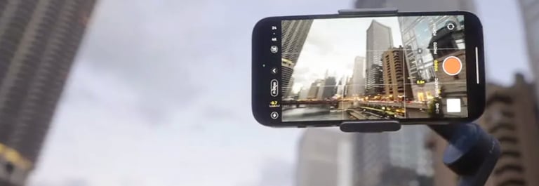 iPhone 14 Pro mounted on a stabilizer, recording cinematic video in an urban setting.
