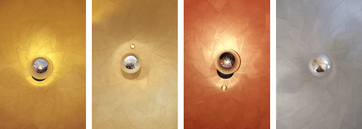 a group of three different colored lights on a wall