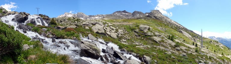 a mountain stream of water flowing down a mountain