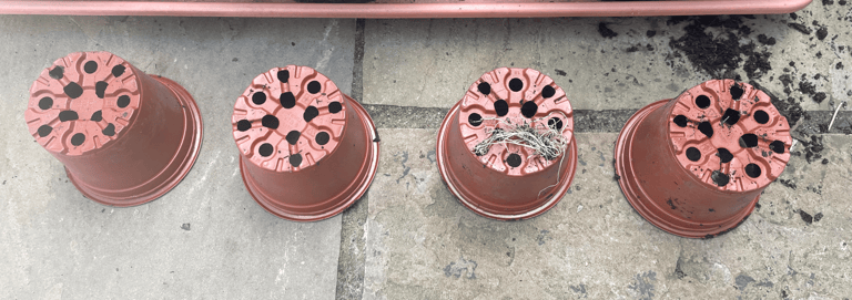 a row of flower pots overturned