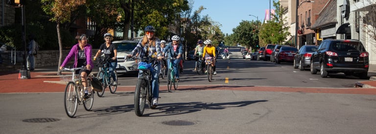 Large group of people biking downtown