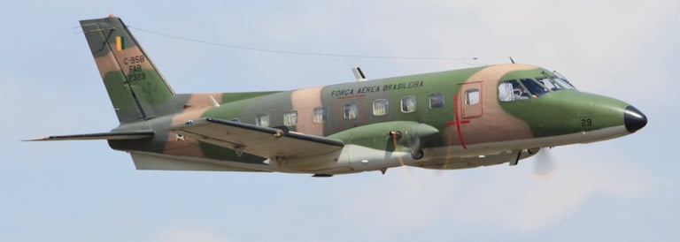 a military plane flying in the sky, embraer 110 emb-110