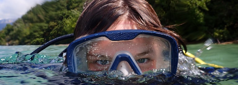 a woman in a diving mask and snorh snorg snorg