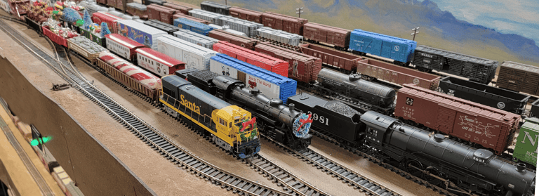 Pichacho Yard in Phoenix, Multiple trains parked decorated for Christmas.