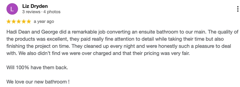 A five-star customer review for a bathroom renovation project highlighting high-quality workmanship and fair pricing.