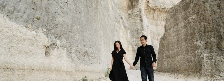 Romantic prewedding couple Candid walking along Melasti Beach cliffs in Bali
