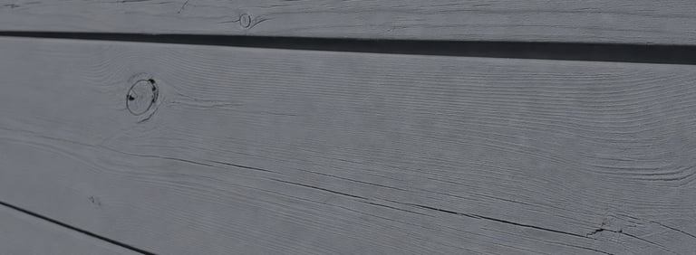 wood fence with visible wood grain beneath breathable linseed oil paint