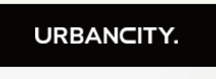 a man in a suit and tie dyes a shirt with the words urban city