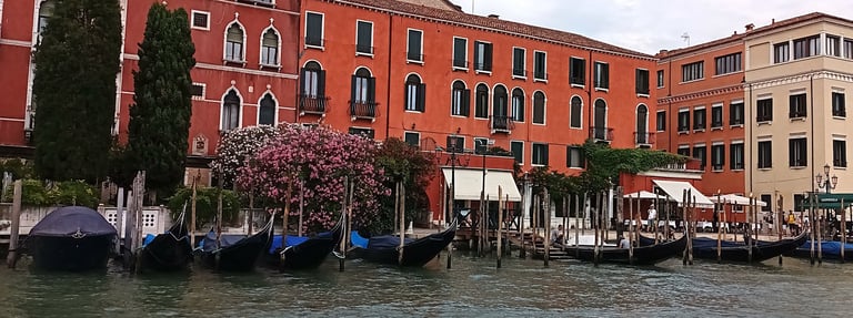 a group of boats on a Canale Grande  in Venice