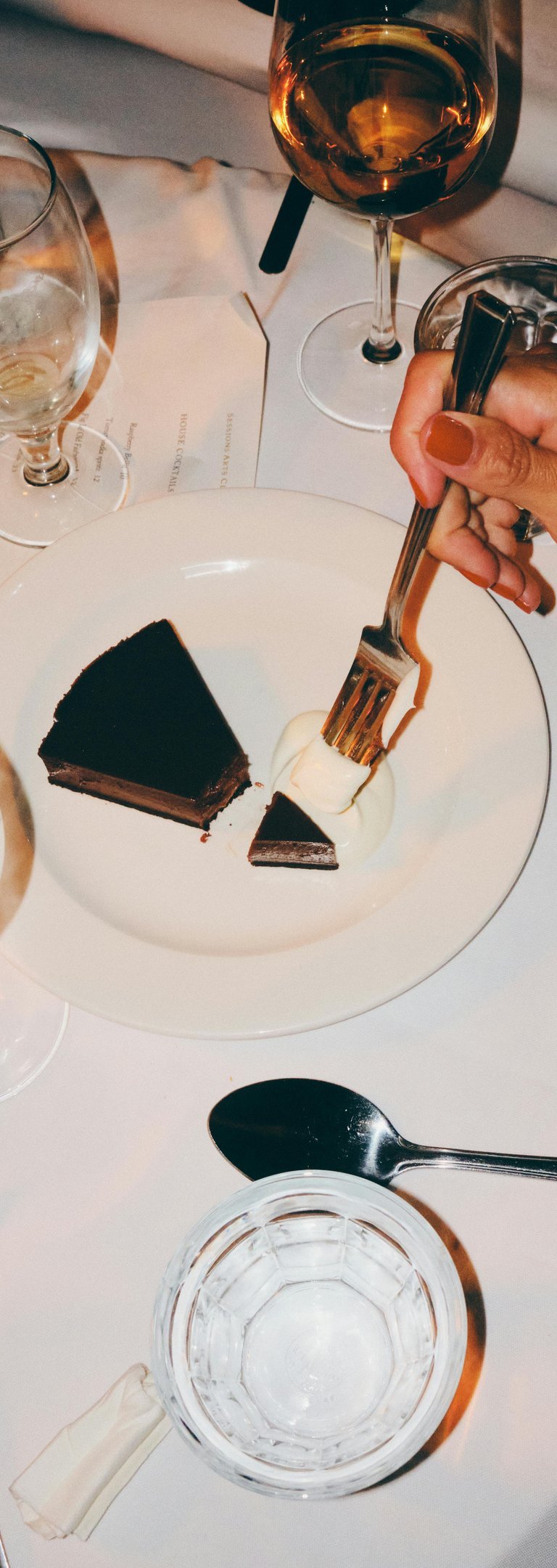 a woman eating desert at a restaurant booked through piano piano concierge where she met her husband
