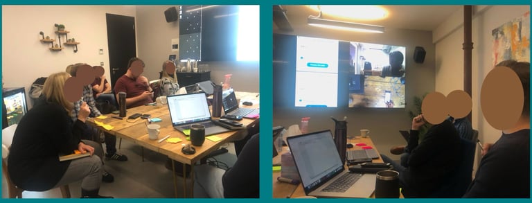 Members of the project team sat around a table observing usability testing. 