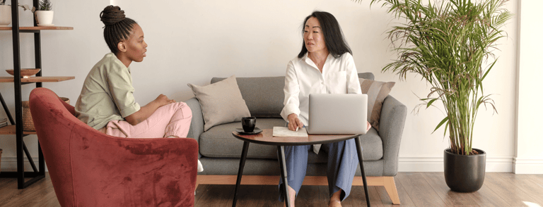 a business woman supporting a client with their financials for benefit paperwork