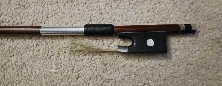 Violin bow with a german silver wrapping and a black goatskin grip