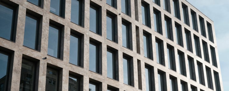 Architectural photography of a contemporary office building in Denmark, emphasizing structure, security, and professional stability.