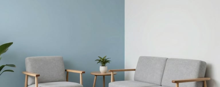 A minimalist consultation room with soft blue and white colors, light wood furniture, and a tranquil atmosphere suitable for psychological therapy. Hispanic architectural details.