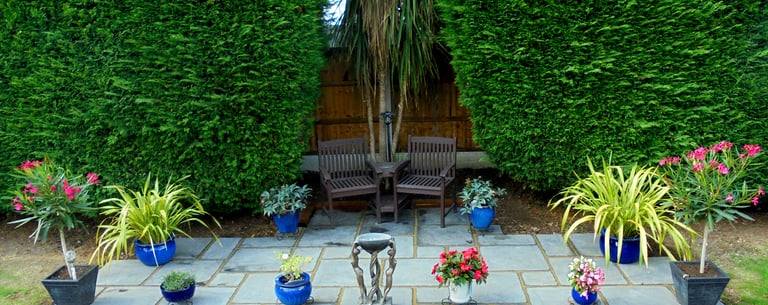 Replica antique stone grey paving slabs patio kit with bench and flowers