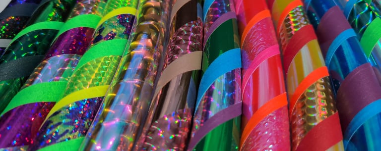 Vibrantly colorful hula hoops tapes with a variety of shiny, prismatic, iridescent tapes