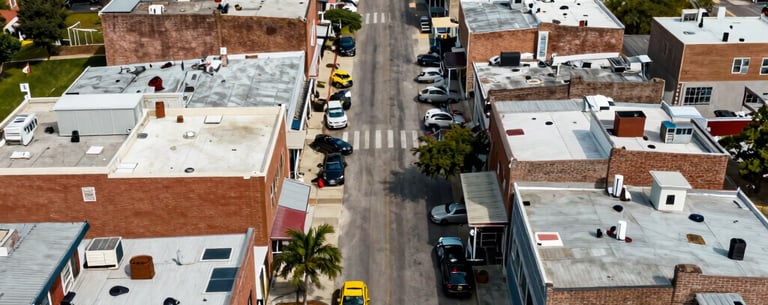 An aerial view of a vibrant small business corridor in a revitalized North American urban district, symbolizing economic empowerment.