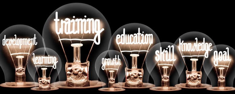 a group of light bulbs with the words learning english in front of a black background