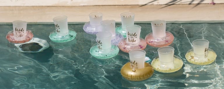 Poolside bridal party atmosphere with floating decorations during Regina celebration at Villa Seminyak Bali