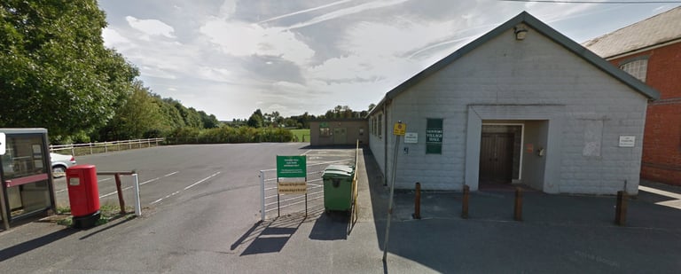 Exterior of Newport Village Hall in Newport near Saffron Walden showing parking area and entrance to baby & toddler venue