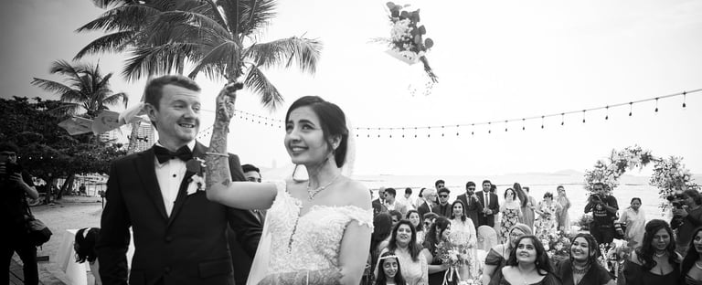 a bride and groom are standing in front of a crowd of people