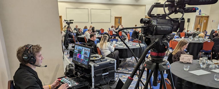 Videographer managing the event recording setup