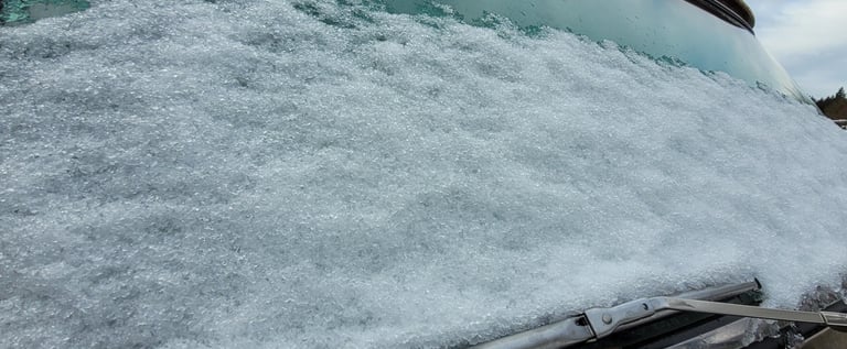 snow on the windshield of an old truck