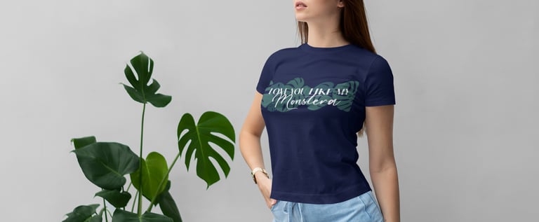 Woman wearing a plant-themed T-shirt styled with botanical accents — Miss Chatty Plants apparel.