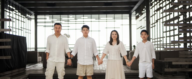 Family portrait in structured architectural space at Alila Villas Uluwatu Bali with clean composition and soft light  