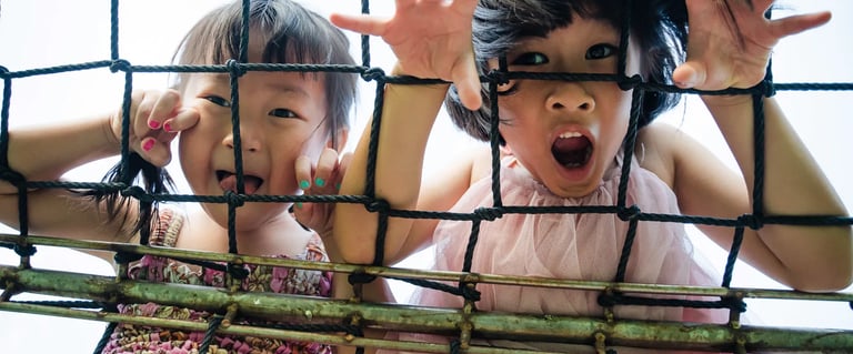 Children playing during family photography session at Legian Bali captured in candid and joyful atmosphere.