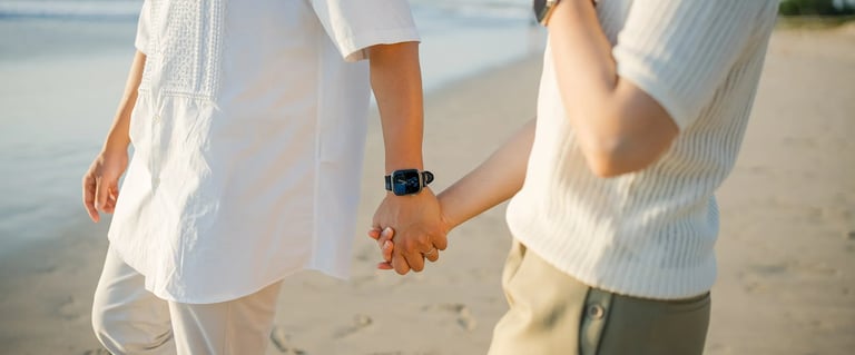 Close-up of parents holding hands during a family photography session at InterContinental Bali Resort
