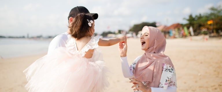 family session Jimbaran Beach Bali mother and child walking together by the sea