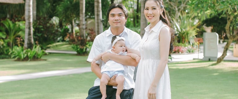 Family sitting together in garden during Sofitel Nusa Dua Bali family photography session