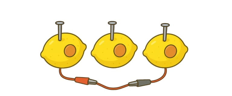 Lemon with coin and screws, connected by wires.