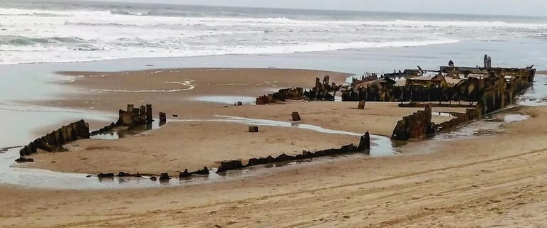 Oregon Coast - sunken steamship buried in the sand at Horsfall Beach, North Bend