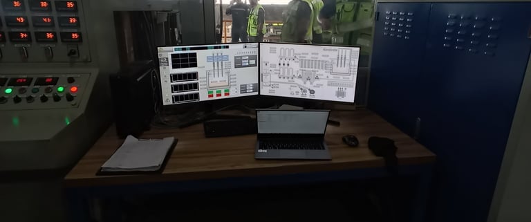 a man in a green jacket and a laptop computer