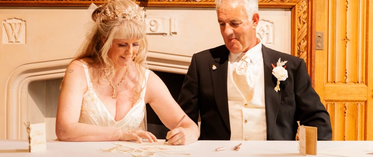 Couple Signing Certificate At Their Tying The Knot Ceremony