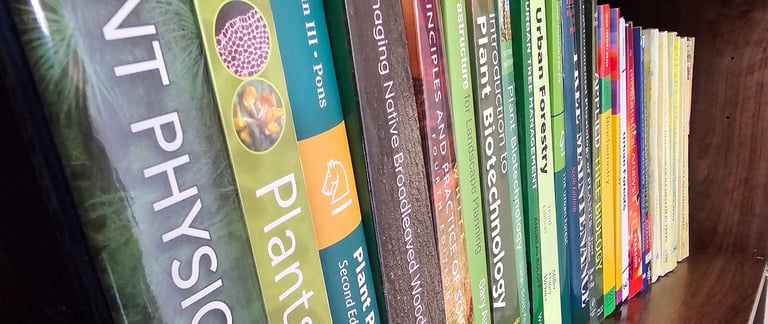 showing a bookshelf with books about trees