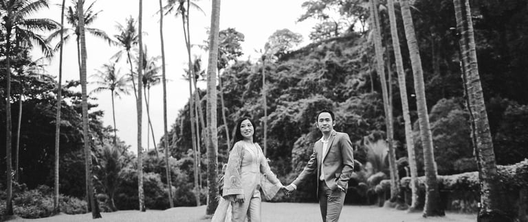 Romantic prewedding walk in palm garden at Amankila Karangasem East Bali