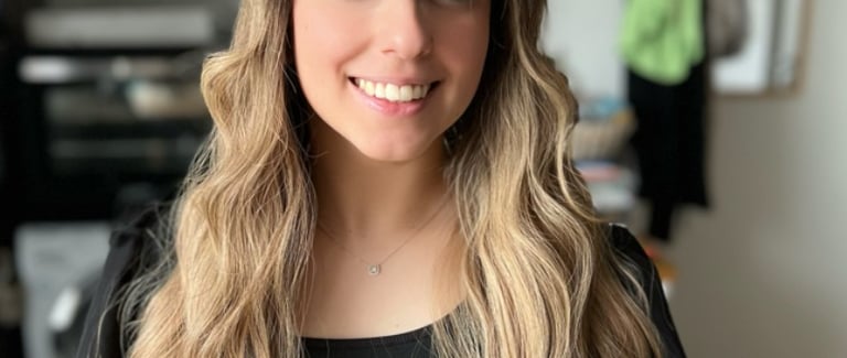 a woman with long blonde hair and a leopard print dress