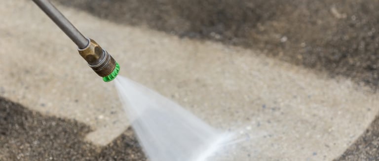 Pressure wash stains off residential driveway
