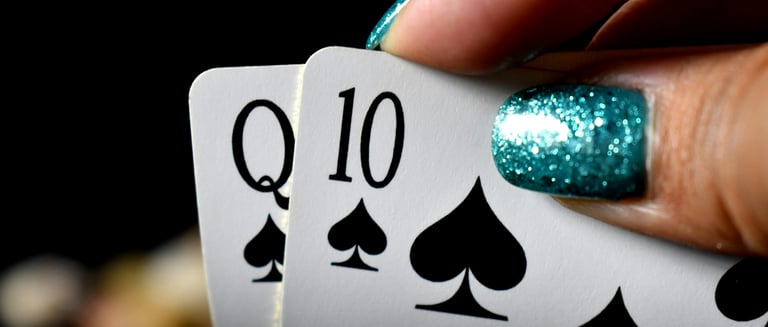 Winning Blackjack hand with blue shiny fingernails