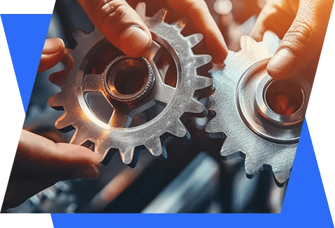 two hands holding gears and gears on a blue background